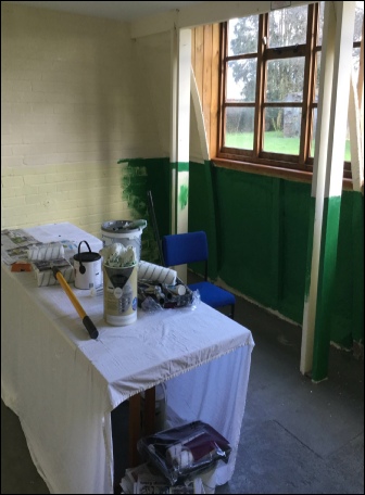 Painting out the Home Front room at Upottery Airfield Nissen Hut